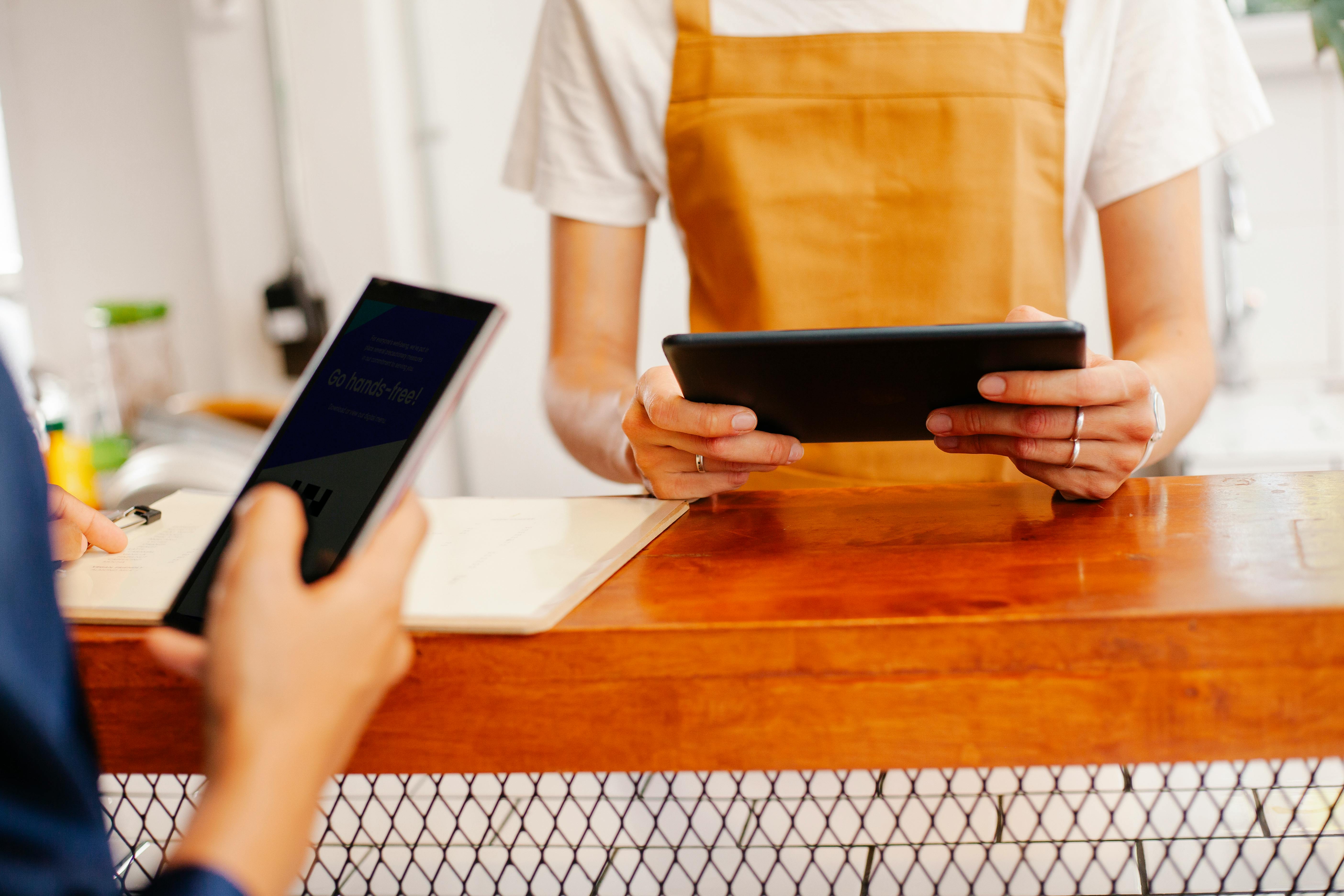 Merchant handing an order across the counter