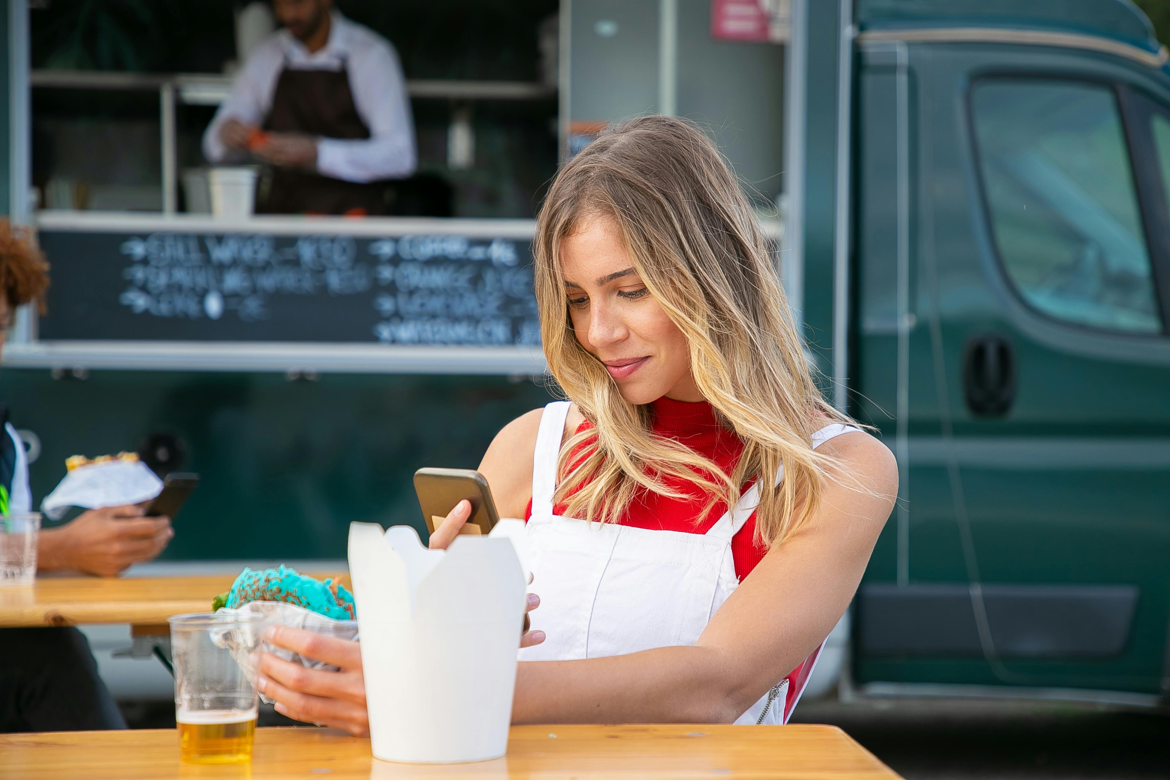 Customer discovering perks at a local food truck